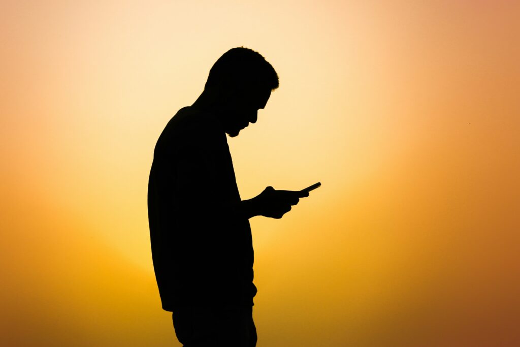 person using his phone - Biometric Authentication Techniques