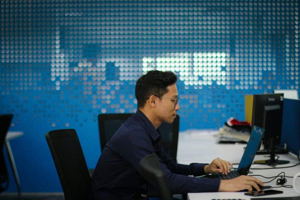 man working on a laptop - Multi Factor Authentication in Banking